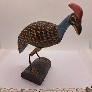 Hand carved wooden Guinea Fowl .